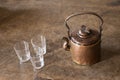 Vintage brass tea pot with empty glasses Royalty Free Stock Photo