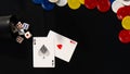 still life on black background with dice with different numbers, two cards and a few colored coins Royalty Free Stock Photo