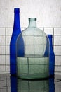 Still life with blue bottles and a jar with water Royalty Free Stock Photo