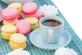 Still life of blue coffee cup, macaroon cookies and marshmallows