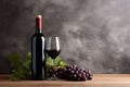 Still life of a bottle of red wine with glass and bunches of grapes Royalty Free Stock Photo