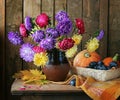 Still life with a bouquet from asters and chrysanthemums Royalty Free Stock Photo
