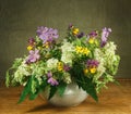 Still life. Bouquet of meadow flowers in white pots Royalty Free Stock Photo