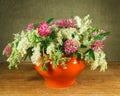 Still life. Bouquet of meadow flowers in white pots Royalty Free Stock Photo