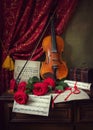 Still life with bouquet of red roses and violin Royalty Free Stock Photo