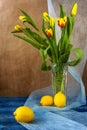 Still life bouquet tulips lemons Royalty Free Stock Photo