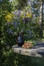 Still life with bouquet of wild flowers and strawberries Royalty Free Stock Photo