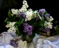 Still life with branches of a colorful lilac tree in a clay vase Royalty Free Stock Photo