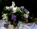 Still life with branches of a colorful lilac tree in a clay vase Royalty Free Stock Photo
