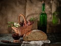 Still life bread in basket and bottle o Royalty Free Stock Photo