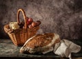 Still life bread in basket and bottle of wine Royalty Free Stock Photo