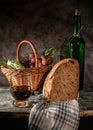 Still life bread in basket and bottle of wine Royalty Free Stock Photo