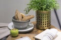 Still life with bread rolls, Apple, a flower on the table.