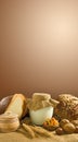 Still life of bread, wheat, nuts, milk, pasta against a wall Royalty Free Stock Photo