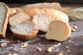 Still life with bread and wheat on wooden table Royalty Free Stock Photo