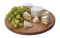 Still life of brie cheese and grapes on a wooden board isolated on a white background. Side view Royalty Free Stock Photo