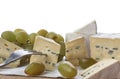 Still life of brie cheese and grapes on a wooden board isolated on a white background. Side view Royalty Free Stock Photo