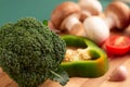 Still life of broccoli, slice of green bell pepper, tomato Royalty Free Stock Photo