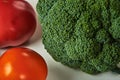 Still life with broccoli, yellow and red tomatoes