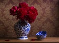 Still life with burgundy peonies in chinese vase Royalty Free Stock Photo