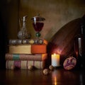 Still life with burning candle and wine. Royalty Free Stock Photo