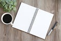 Top view or flat lay of open notebook with blank pages, coffee on office desk table with copy space Royalty Free Stock Photo