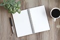 Top view or flat lay of open notebook with blank pages, coffee on office desk table with copy space Royalty Free Stock Photo