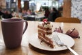 Still life in a cafe. Cup of coffee or tea, plate of half-eaten cake. Royalty Free Stock Photo