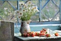 Still life with camomiles and strawberry