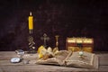 Still life, candle, candlestick, jewelry box on the table