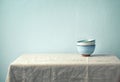 Still life with ceramic bowls on a tabel laid with a linen cloth. Culinary concept