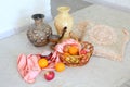 Still life with ceramic jugs and fruits in a basket Royalty Free Stock Photo