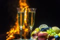 Still life with champagne on the background of fire Royalty Free Stock Photo