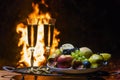 Still life with champagne on the background of fire Royalty Free Stock Photo