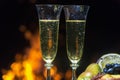 Still life with champagne on the background of fire Royalty Free Stock Photo