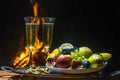 Still life with champagne on the background of fire Royalty Free Stock Photo