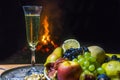 Still life with champagne on the background of fire Royalty Free Stock Photo