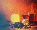 Still-life with cheese, grapes and glass of red wine. Royalty Free Stock Photo