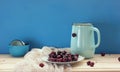 Still life with cherry and jug.