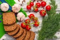 Still life: cherry tomatoes, black bread, garlic, fennel, bayber Royalty Free Stock Photo