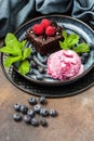 Still life with chocolate brownie and  ice cream ball  on dark table Royalty Free Stock Photo