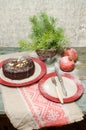 Still life with chocolate cake, Christmas tree and pomegranate Royalty Free Stock Photo