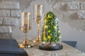 Modern christmas decoration table display. Cute little festive glas Cloche filled with green hydrangea flowers Royalty Free Stock Photo