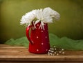 Still life with chrysanthemum flowers in red jug Royalty Free Stock Photo