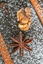 Still-life of cinnamon, star anise and walnut on magic Christmas holiday on wooden background Royalty Free Stock Photo