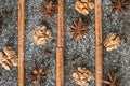 Still-life of cinnamon, star anise and walnut on magic Christmas holiday on wooden background Royalty Free Stock Photo