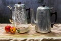 Still life classic kettle with cup and lamp and apple