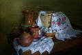 Still life with pottery, basket and embroidered towel . Royalty Free Stock Photo