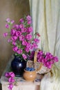 Still life with clay jug and kettle  Cup and basket with embroidered flower towel Royalty Free Stock Photo