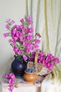 Still life with clay jug and kettle  Cup and basket with embroidered flower towel Royalty Free Stock Photo